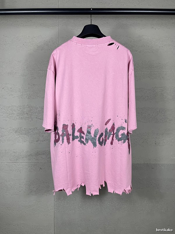 Balenciaga's pink T-shirt with a hole and graffiti style